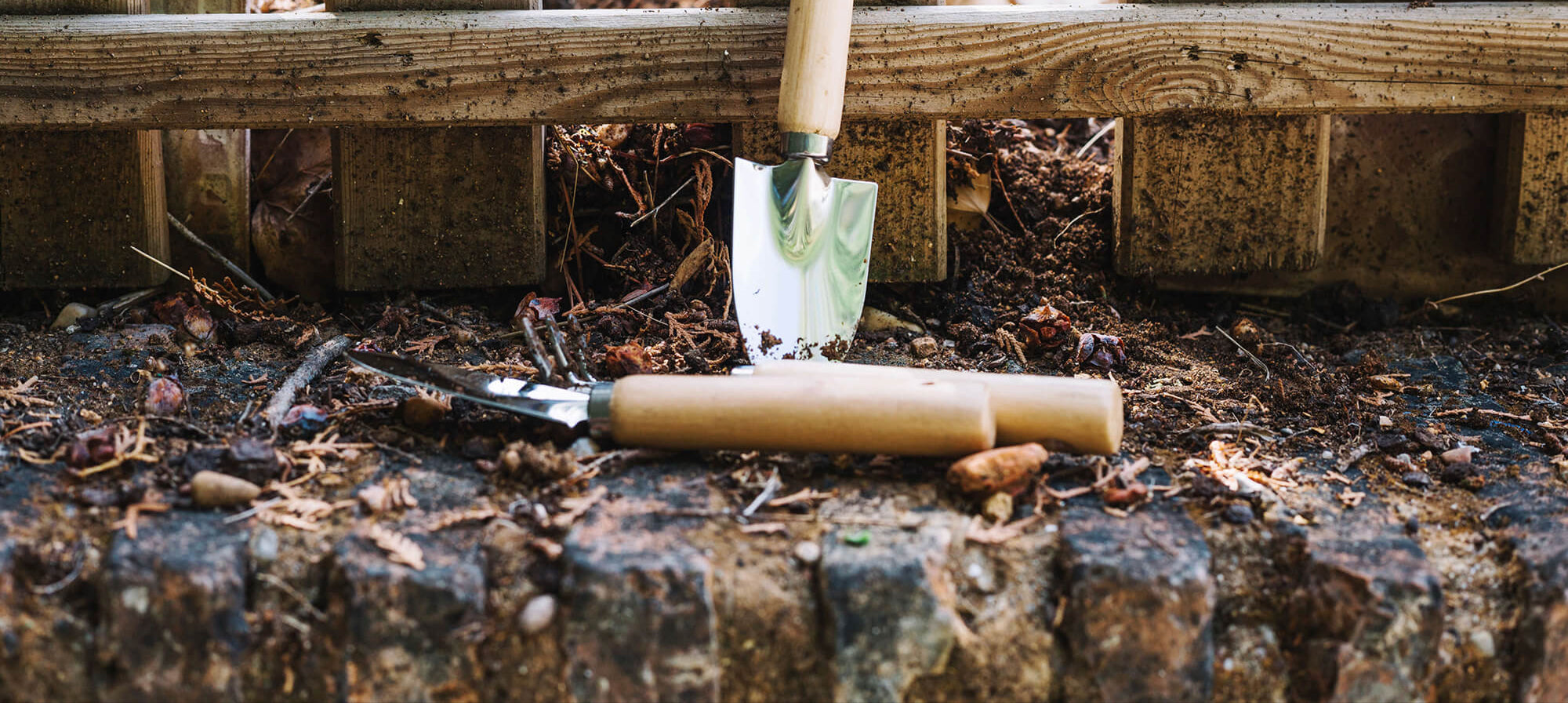 trowels-near-fence